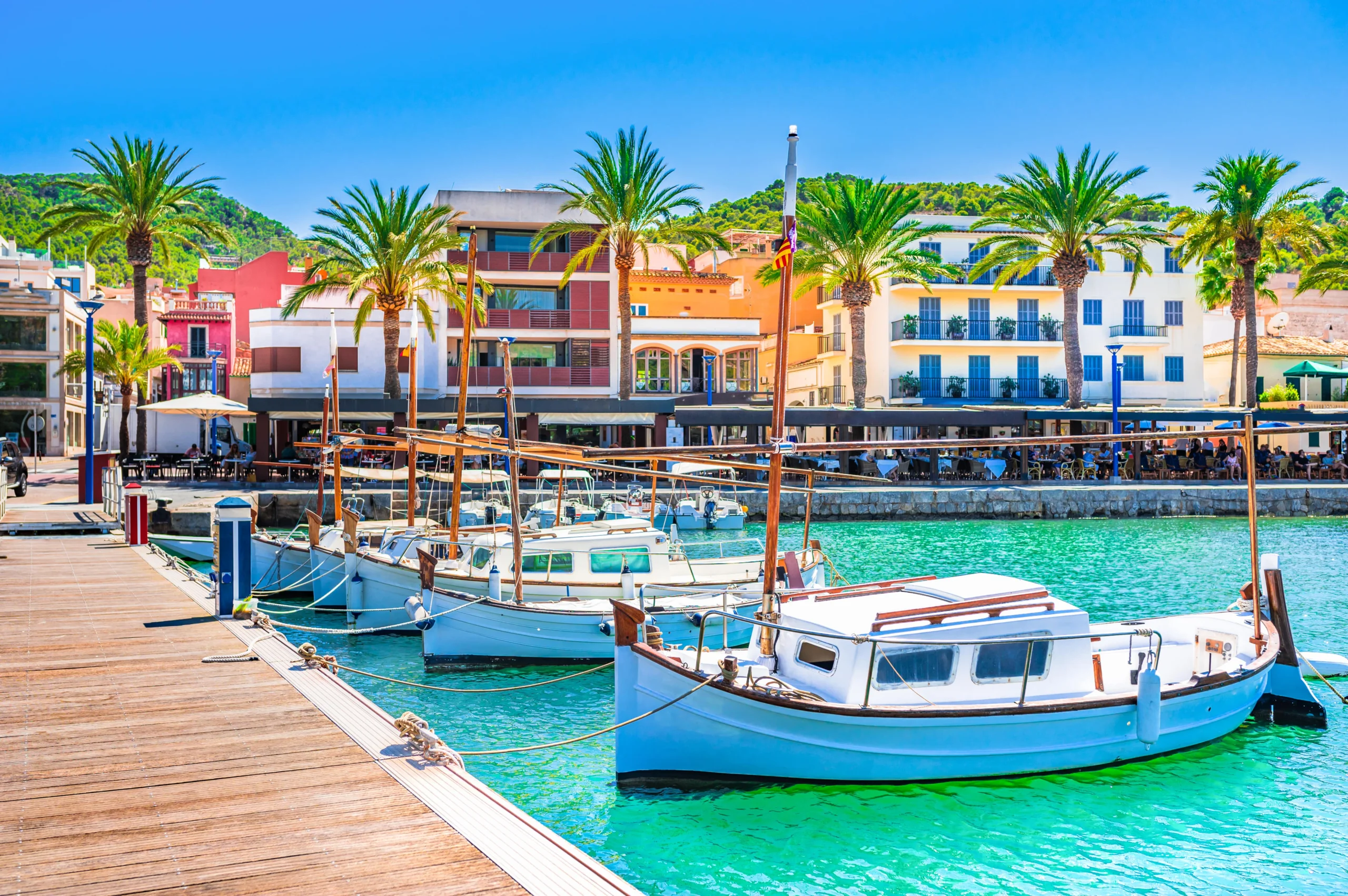 Aerial view of Port d'Andratx marina and luxury waterfront villas at golden hour, Majorca luxury property