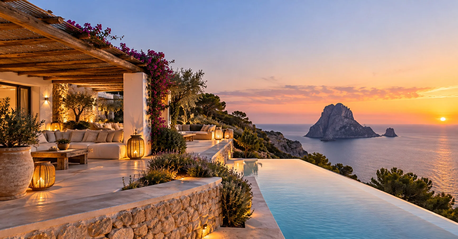 A turquoise Ibiza cove with a yacht at anchor and a villa on the headland.
